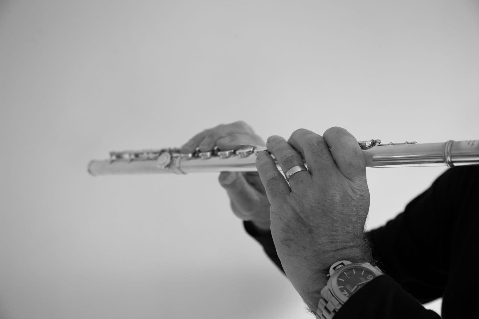 Close-up of a musician playing a flute